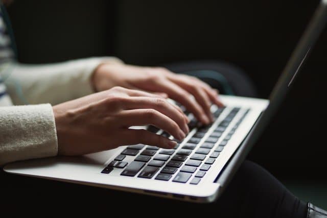 Student writing a scholarship essay